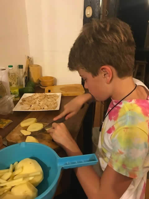 Boy volunteer preparing chips image