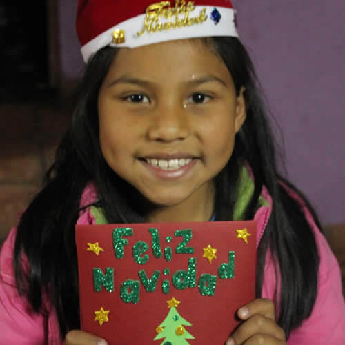 Smiling girl holding Christmas card image